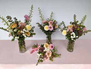 Each bucket makes about 4 small vase arrangements. You alternatively make 2 large arrangements, or 16+ bud vases